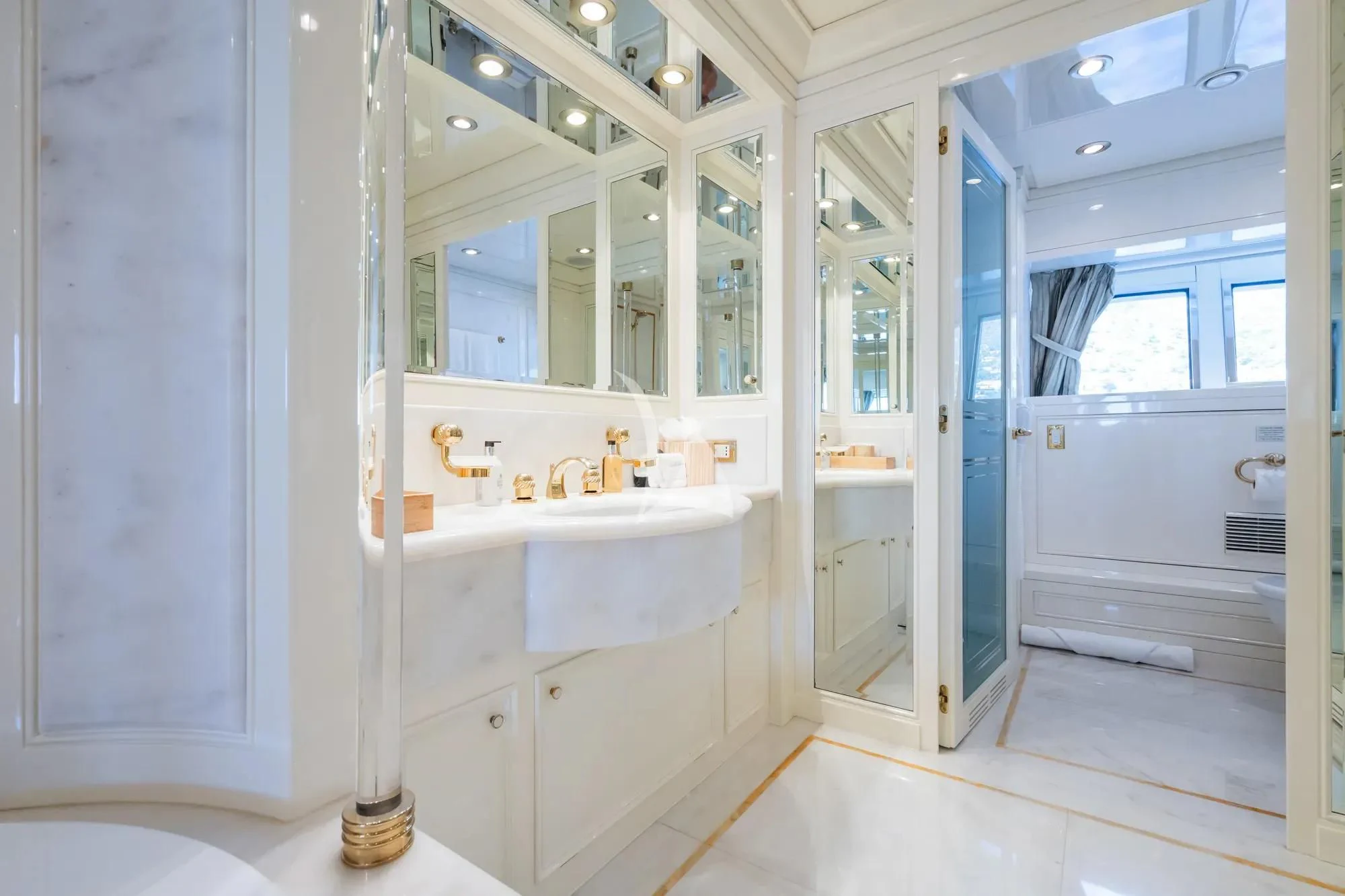 a bathroom with a large mirror aboard TE MANU Yacht for Charter