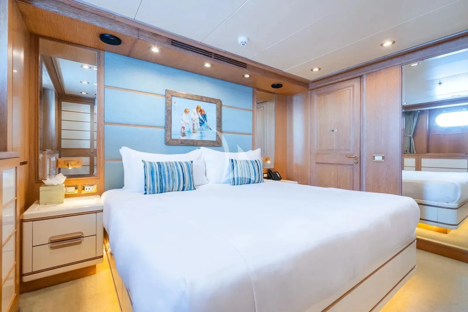 a bedroom with a large bed aboard TE MANU Yacht for Charter