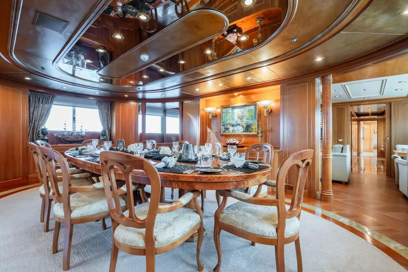 a dining room table set for a dinner party aboard TE MANU Yacht for Charter