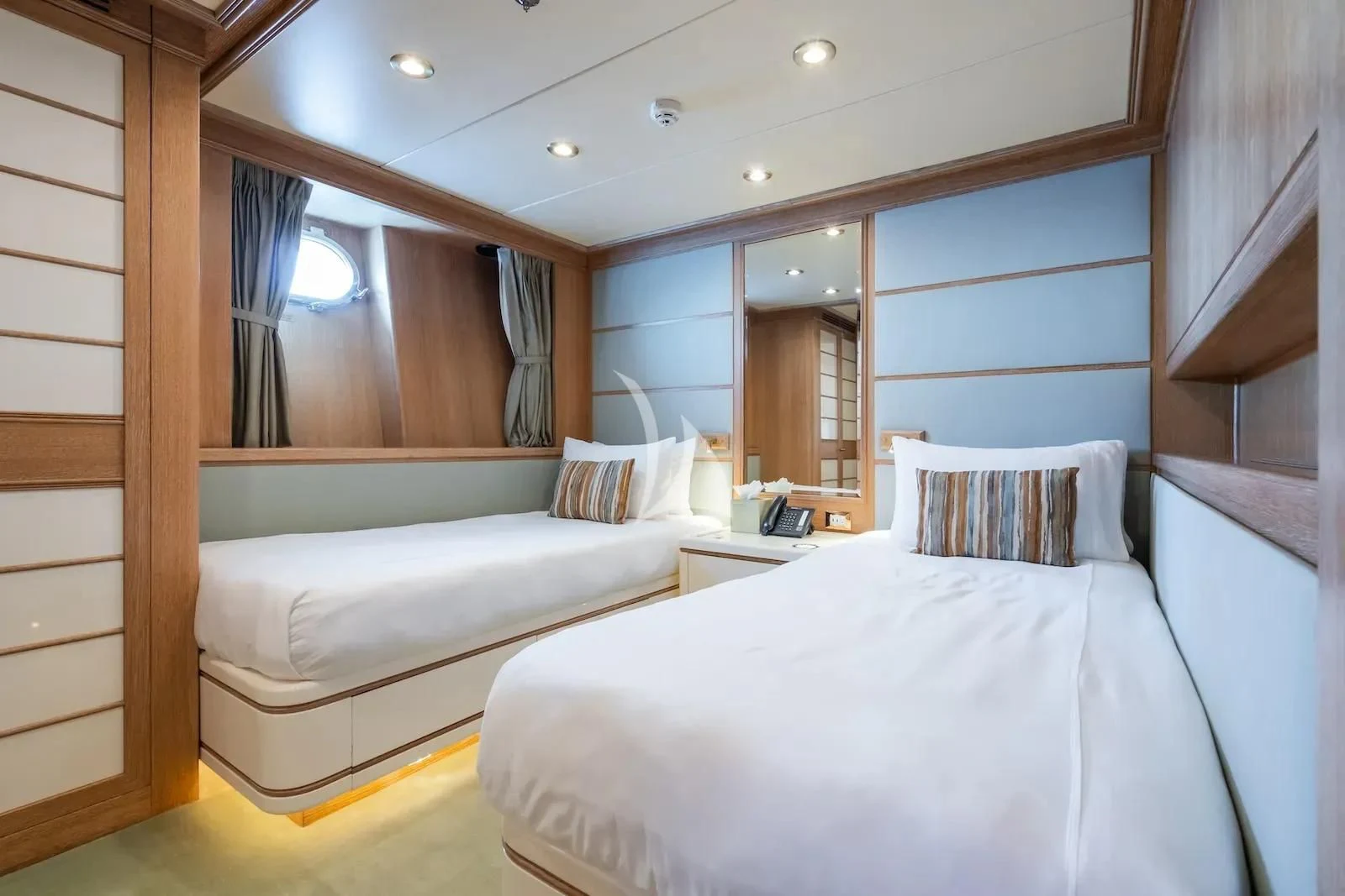 a room with two beds aboard TE MANU Yacht for Charter