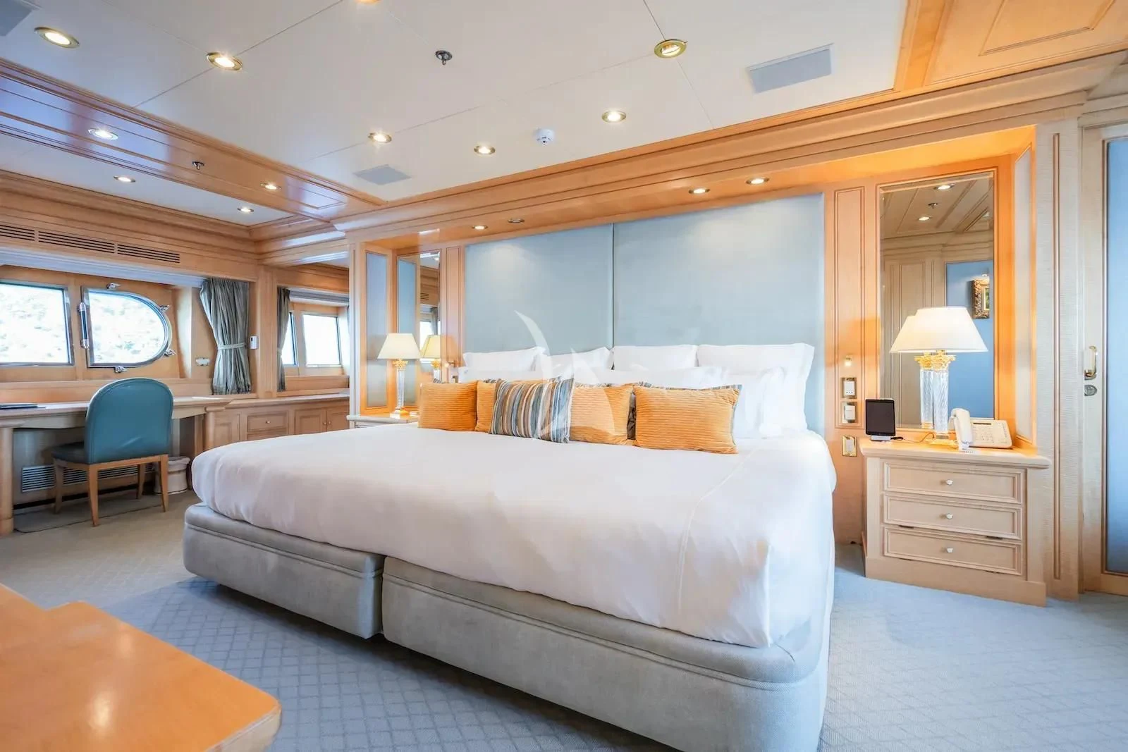 a large bed in a room aboard TE MANU Yacht for Charter