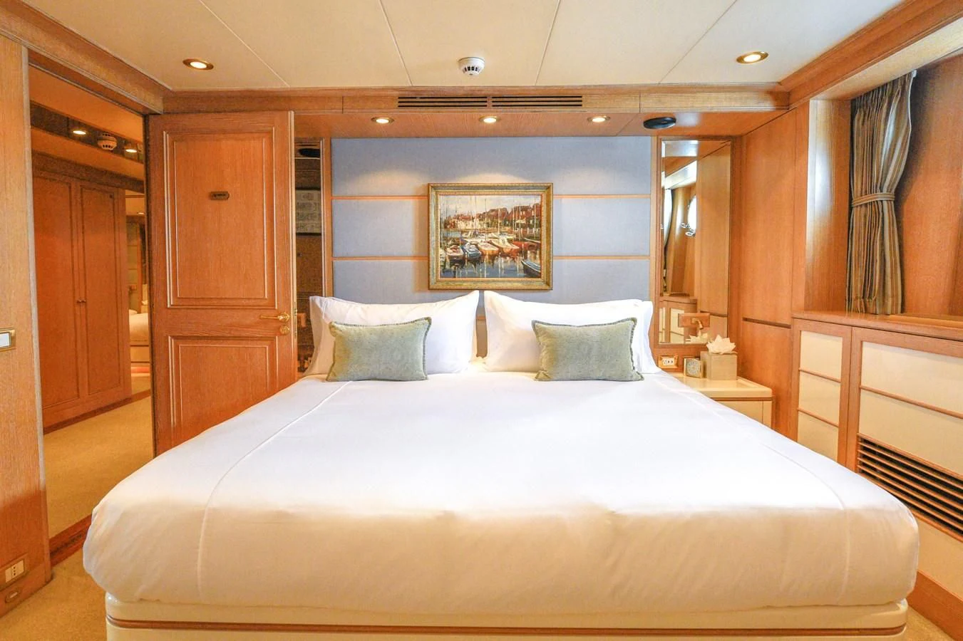 a large bed in a hotel room aboard TE MANU Yacht for Charter