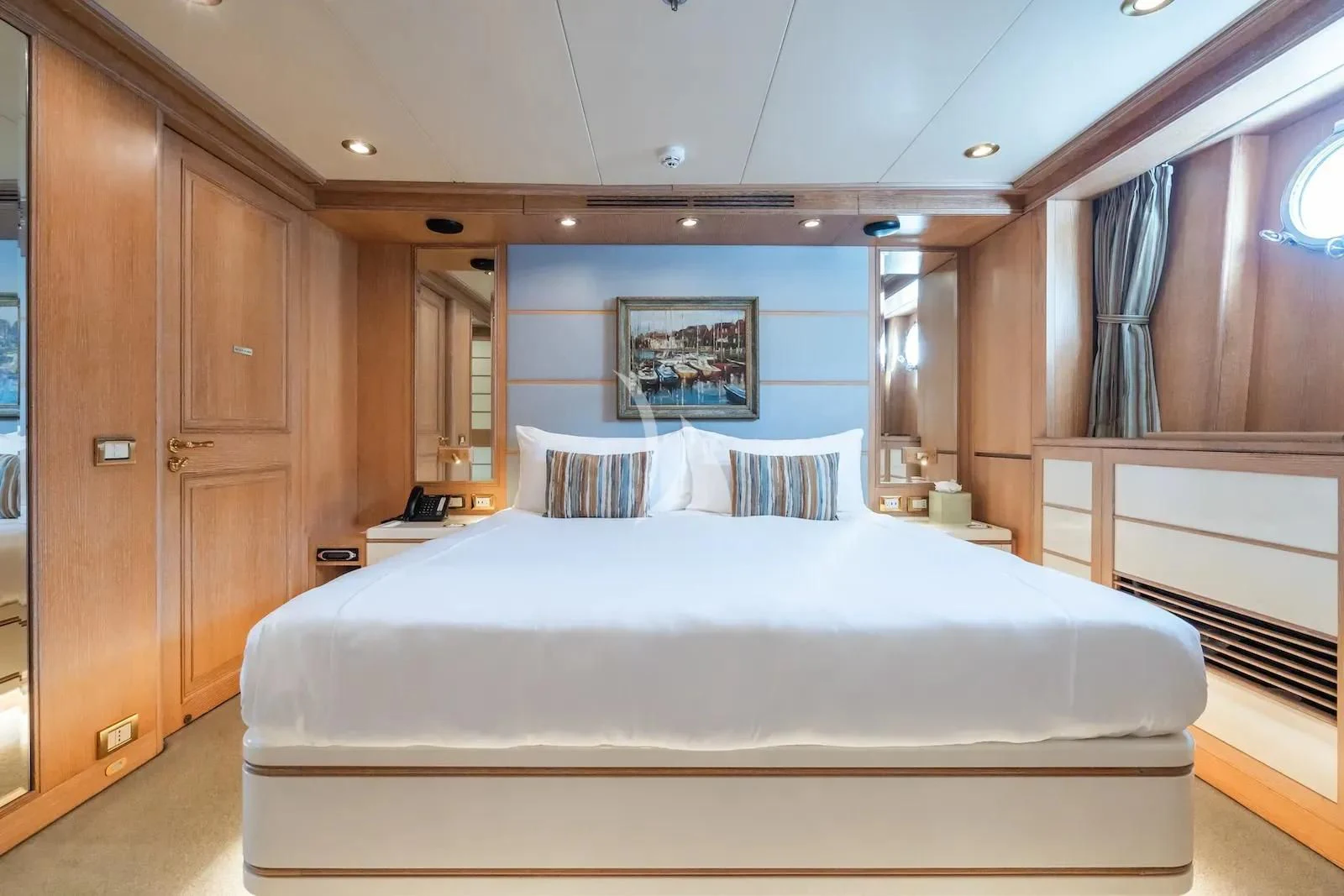 a bed in a room aboard TE MANU Yacht for Charter