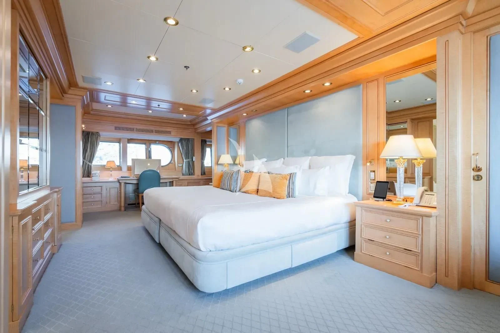 a bedroom with a large bed aboard TE MANU Yacht for Charter