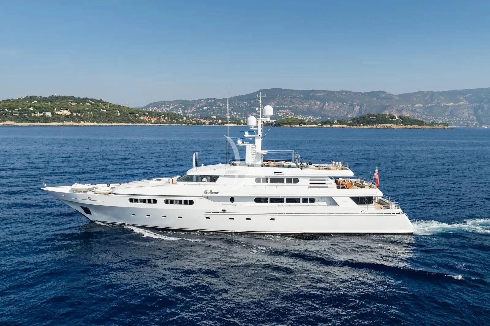 a white yacht on the water aboard TE MANU Yacht for Charter