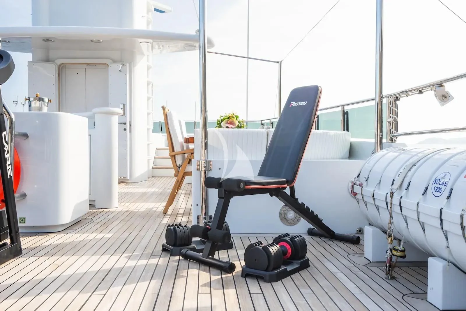 a room with a table and chairs aboard TE MANU Yacht for Charter