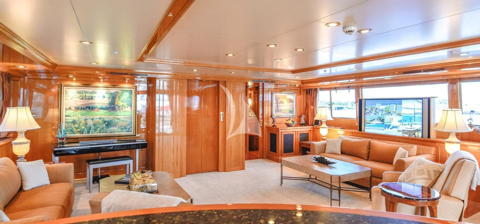 a living room with a fireplace aboard TE MANU Yacht for Charter