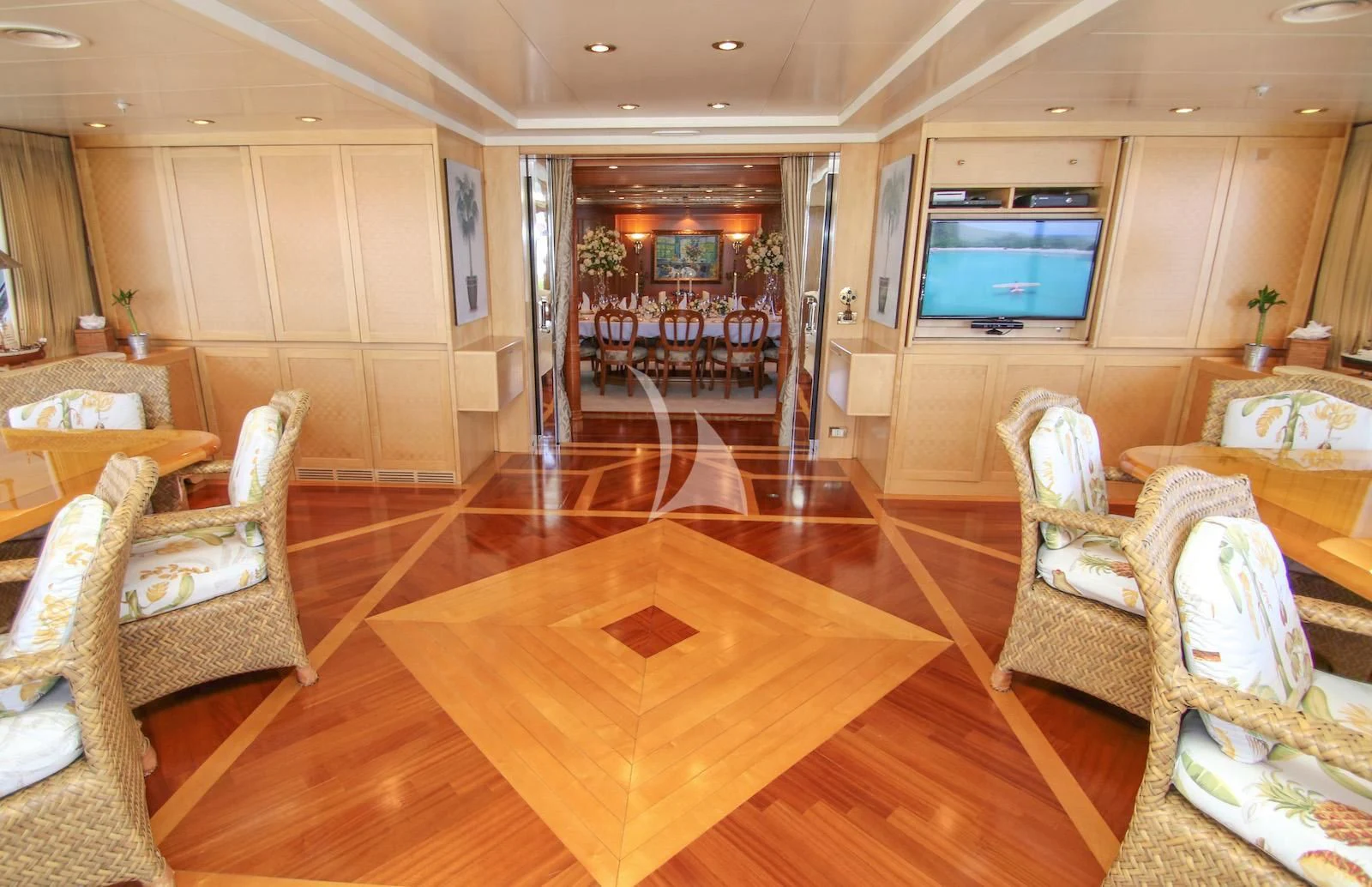 a living room with a large screen aboard TE MANU Yacht for Charter