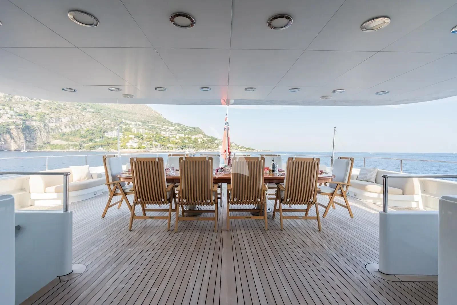 a room with tables and chairs aboard TE MANU Yacht for Charter