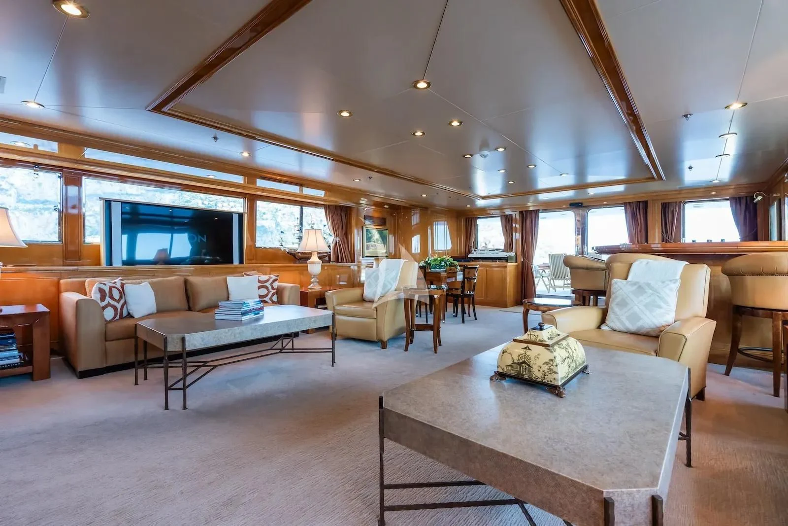 a living room with a table and chairs aboard TE MANU Yacht for Charter