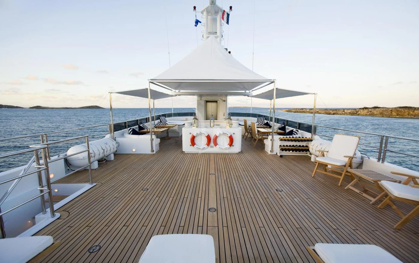 a boat dock with chairs and a covered gazebo on it aboard TE MANU Yacht for Charter