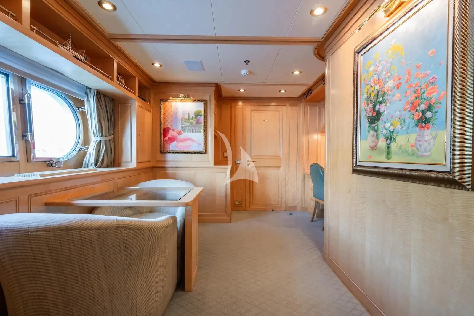 a room with a table and chairs aboard TE MANU Yacht for Charter