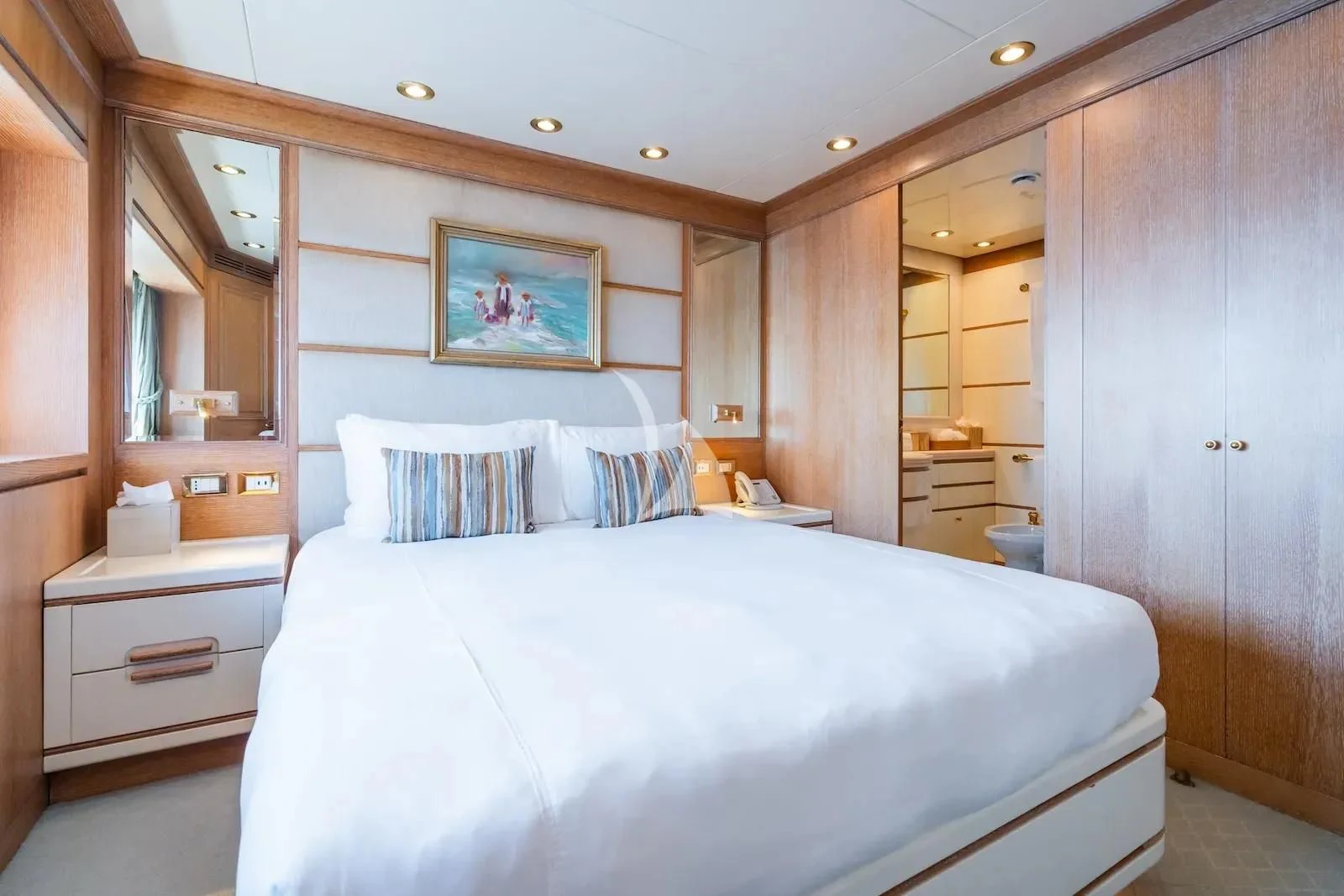 a bedroom with a bed and a closet aboard TE MANU Yacht for Charter