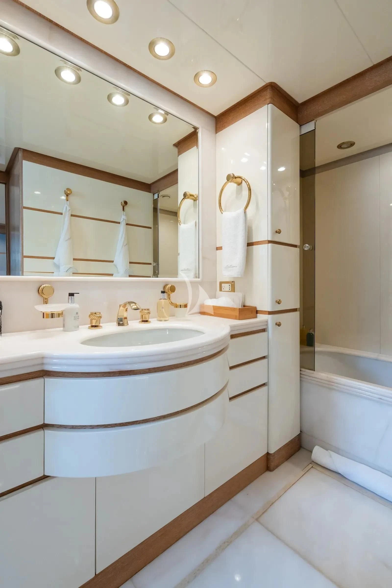 a bathroom with a large mirror aboard TE MANU Yacht for Charter