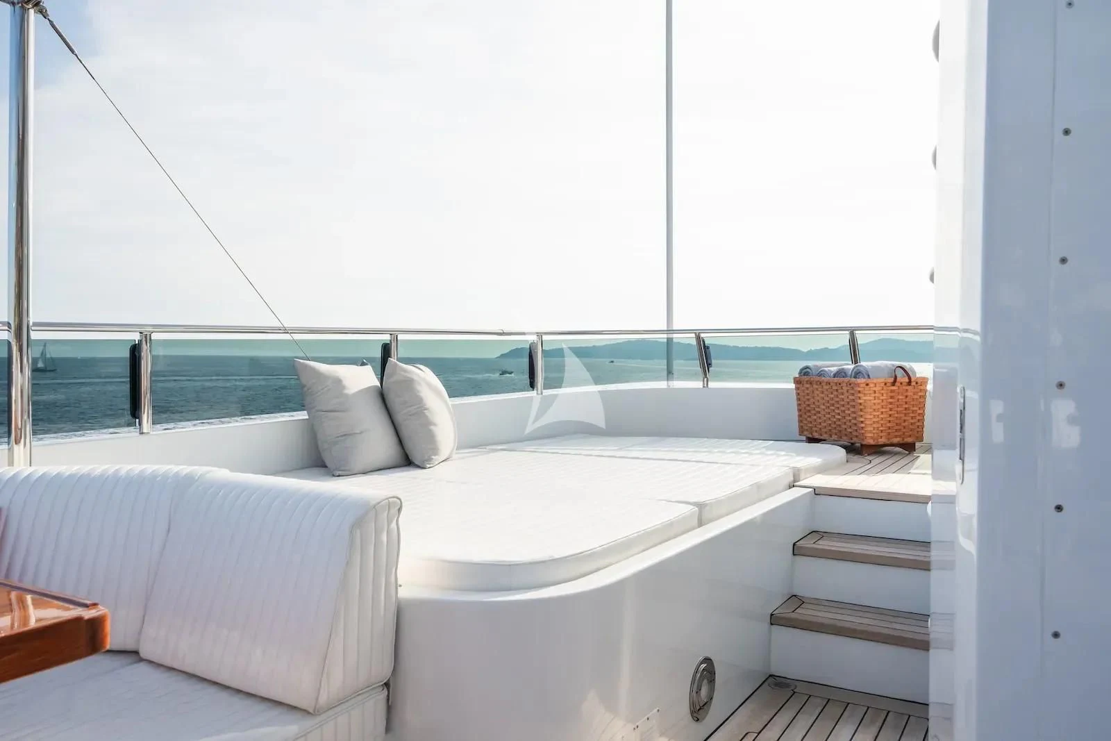 a large white bathtub with a white tile floor aboard TE MANU Yacht for Charter