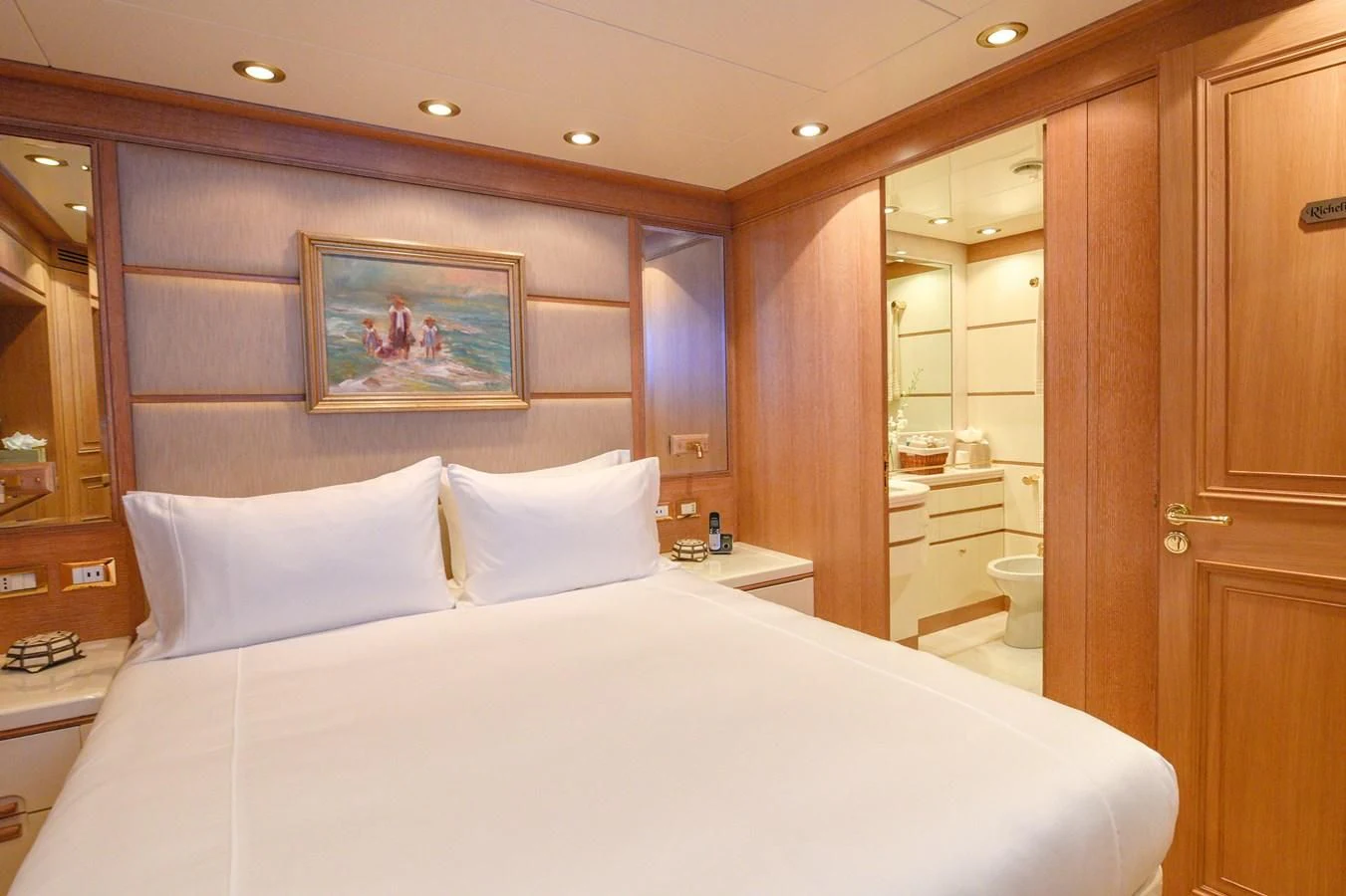 a bed in a hotel room aboard TE MANU Yacht for Charter