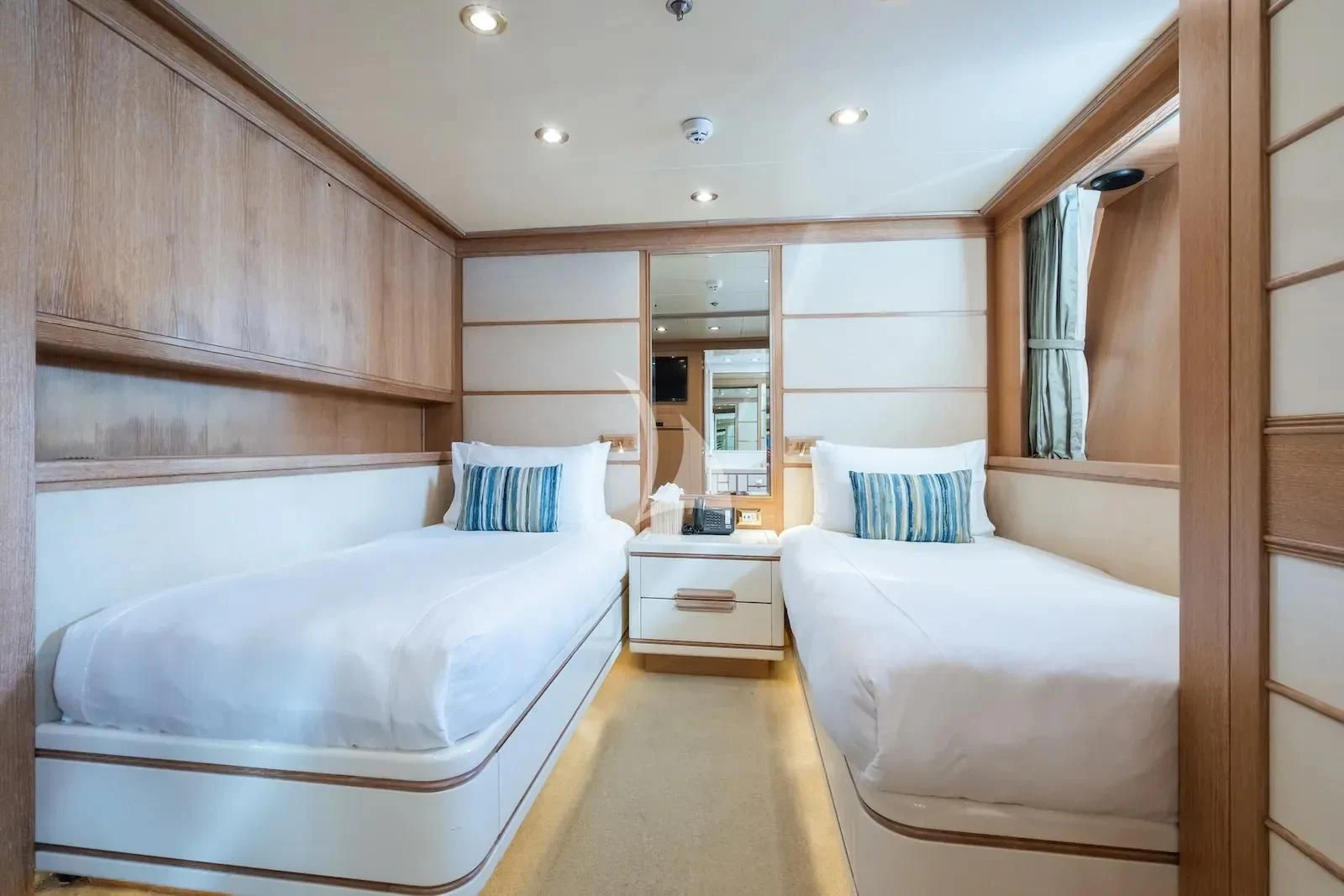 a room with two beds aboard TE MANU Yacht for Charter