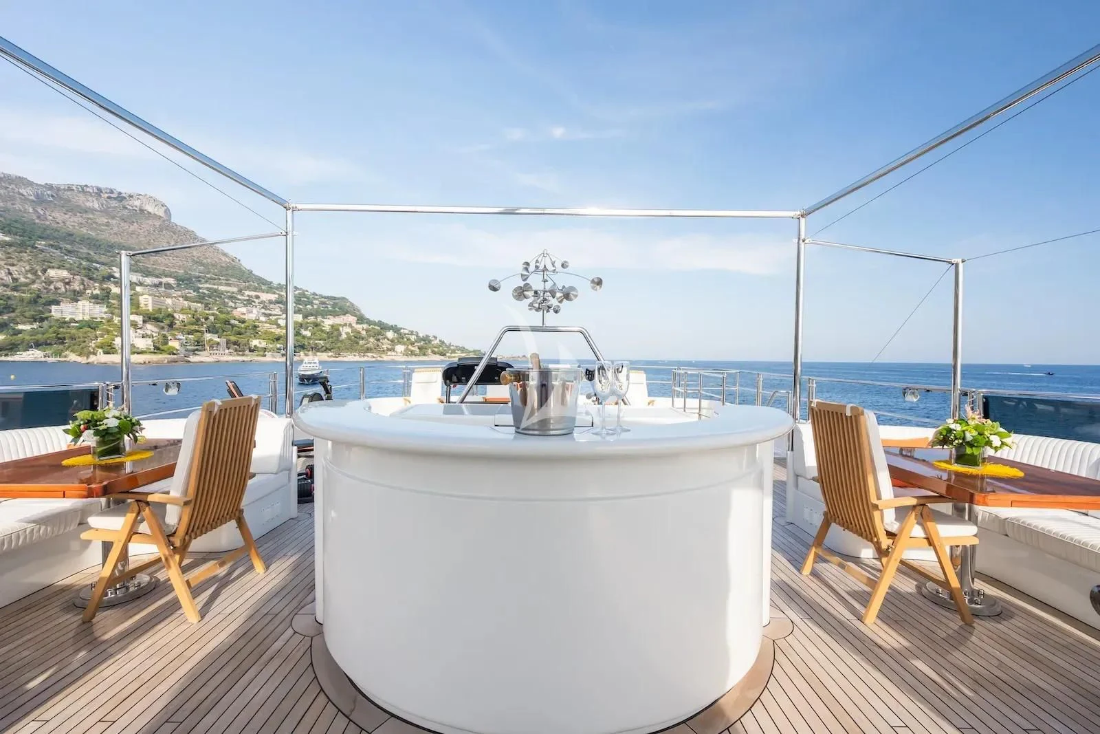 a white tub on a deck overlooking a body of water aboard TE MANU Yacht for Charter