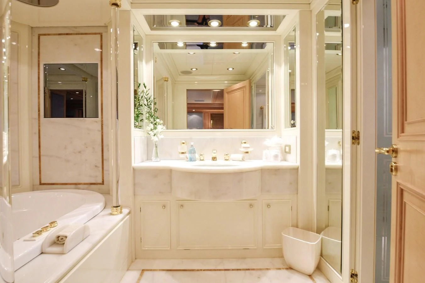 a bathroom with a large mirror aboard TE MANU Yacht for Charter