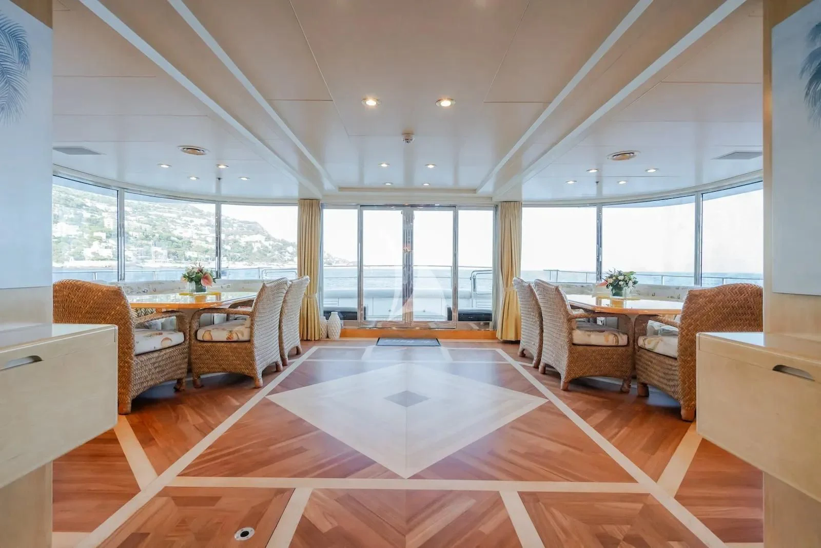 a large living room with a large window aboard TE MANU Yacht for Charter