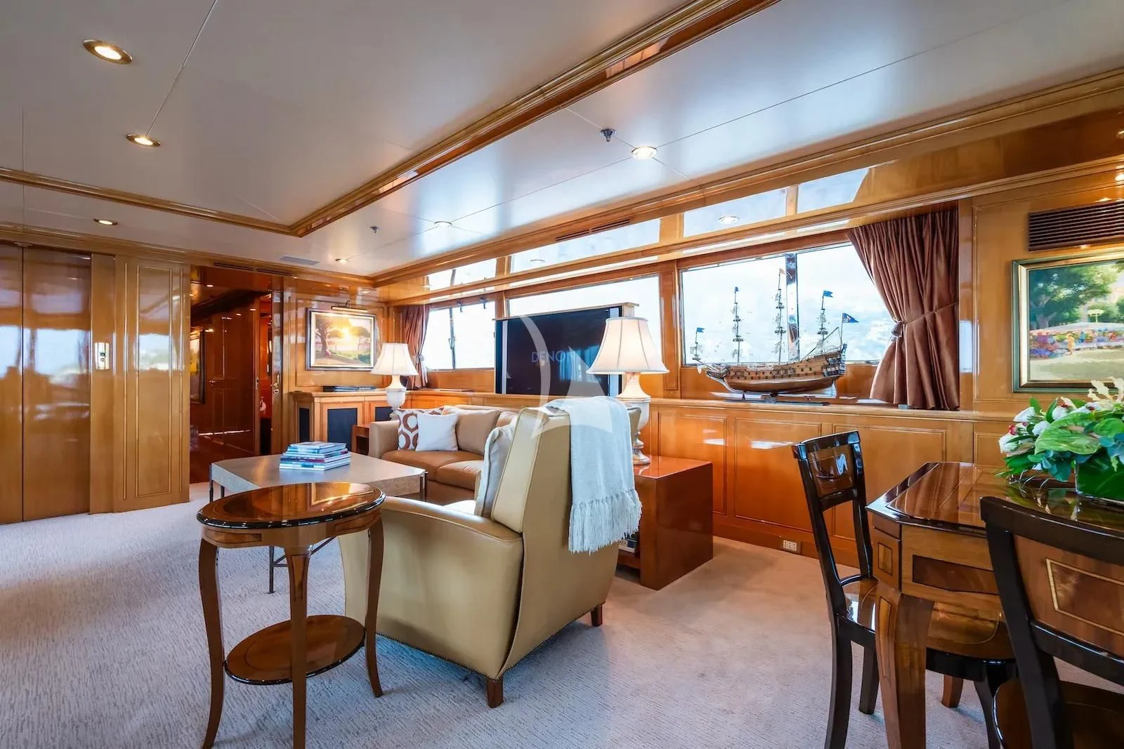 a living room with a couch and a table aboard TE MANU Yacht for Charter