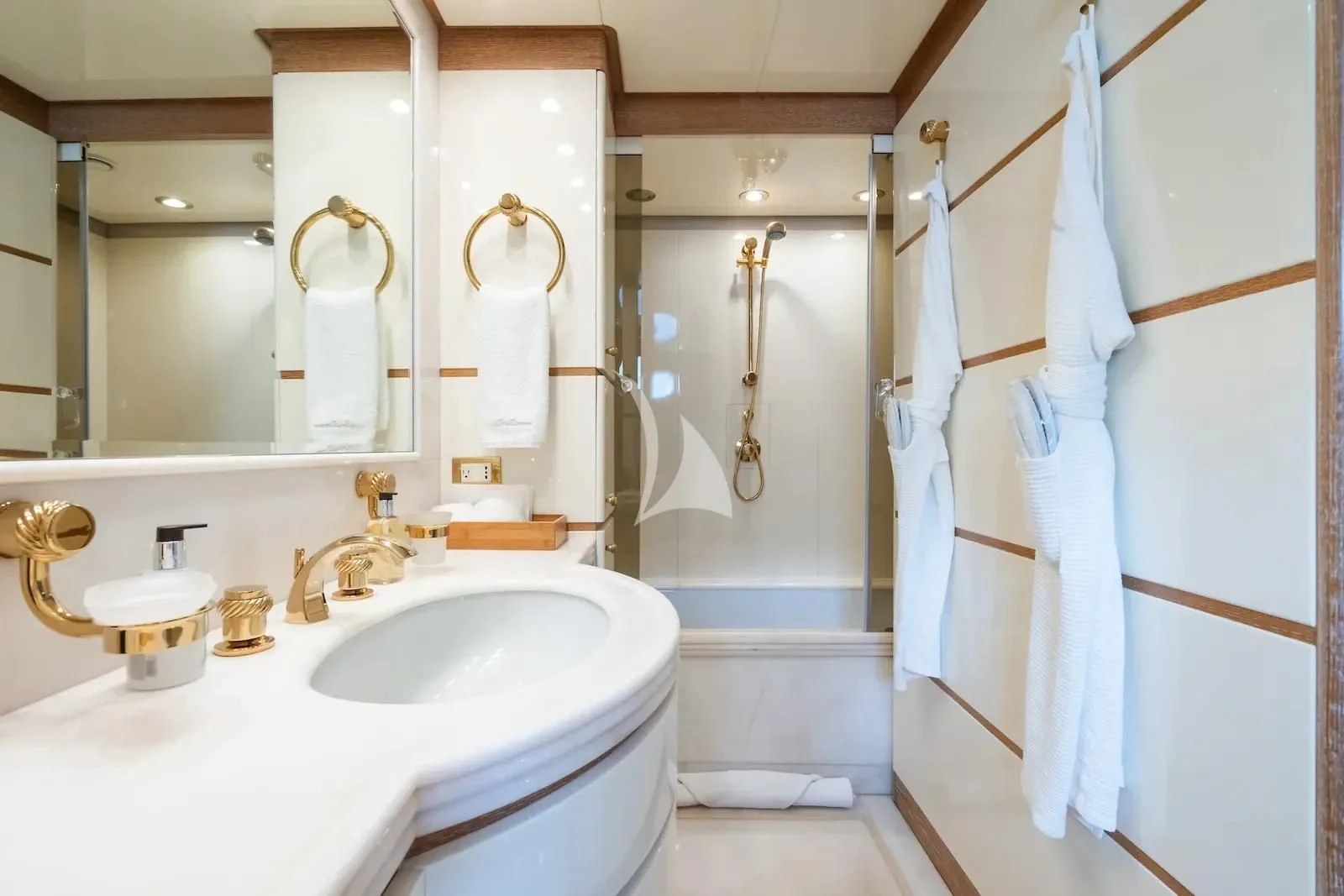 a bathroom with a sink and toilet aboard TE MANU Yacht for Charter