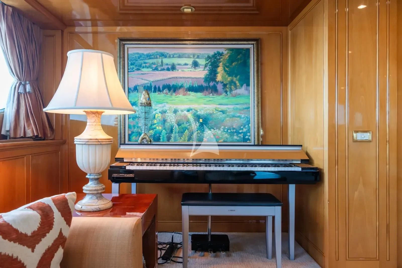 a piano in a room aboard TE MANU Yacht for Charter