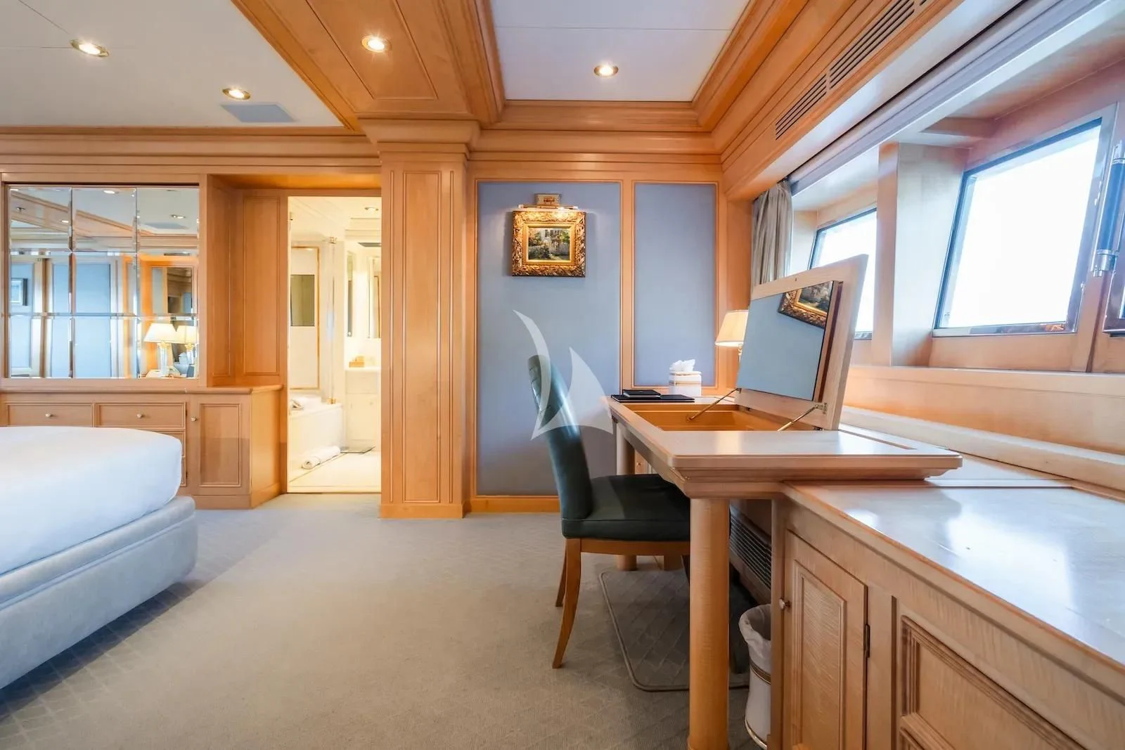 a room with a desk and a laptop aboard TE MANU Yacht for Charter
