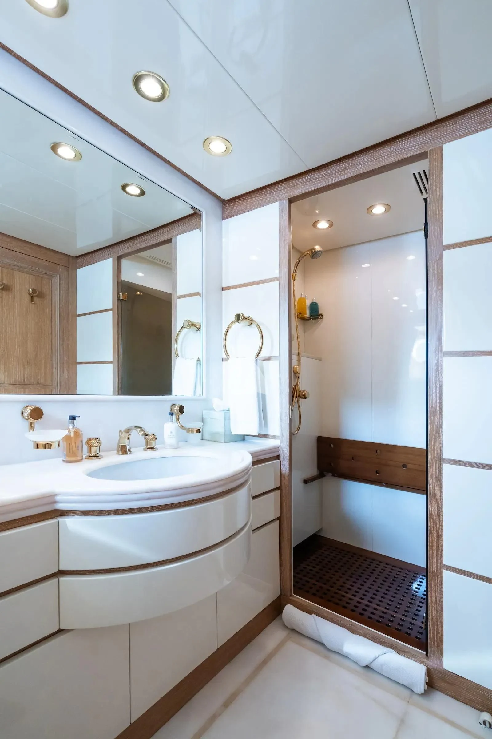 a bathroom with a large mirror aboard TE MANU Yacht for Charter