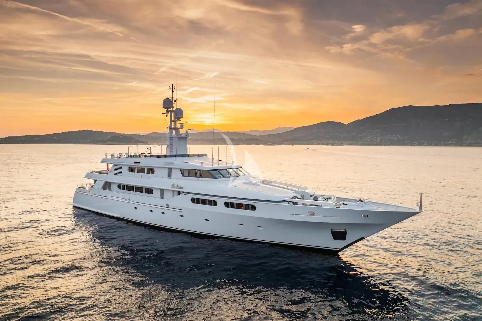 a white ship in the water aboard TE MANU Yacht for Charter