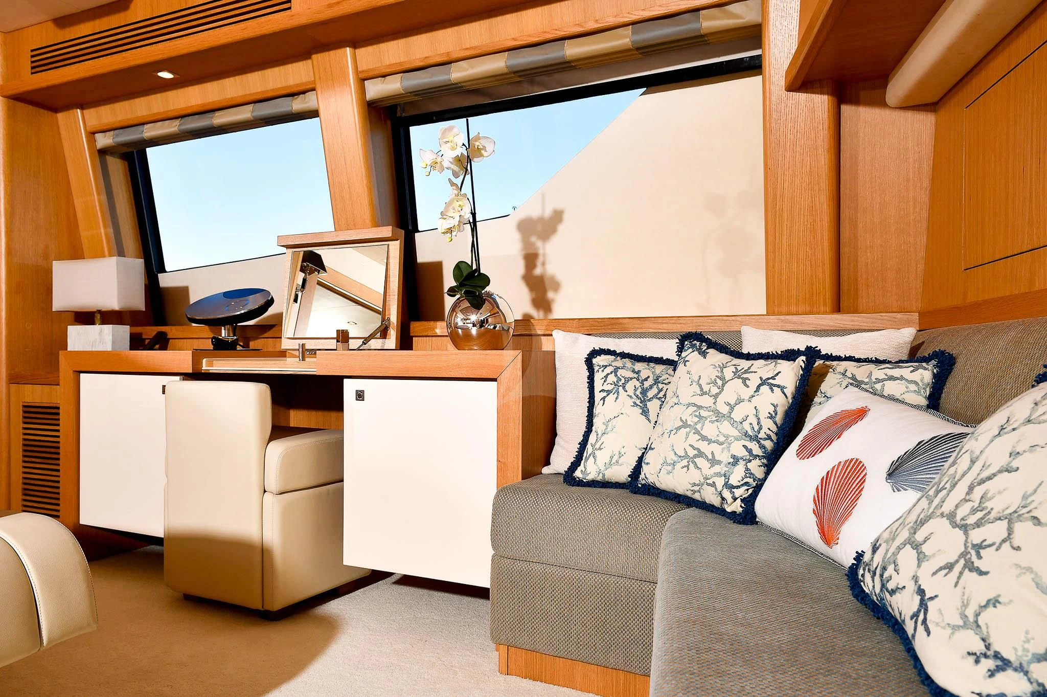 a living room with a couch and a desk aboard TENACITY Yacht for Sale