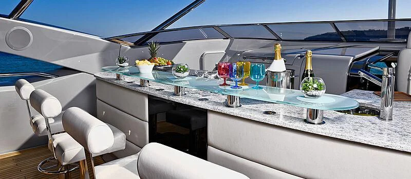 a white table with drinks and fruits on it aboard TENACITY Yacht for Sale