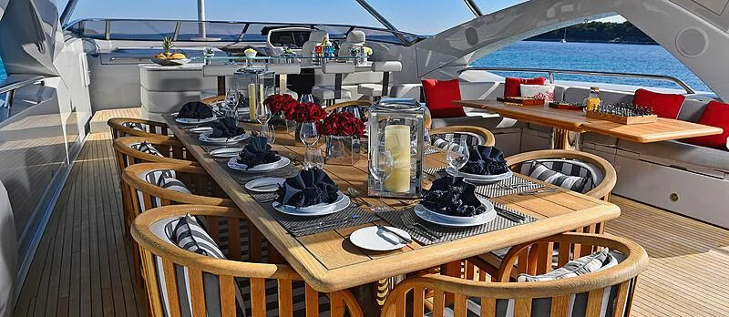 a boat with a table and chairs aboard TENACITY Yacht for Sale