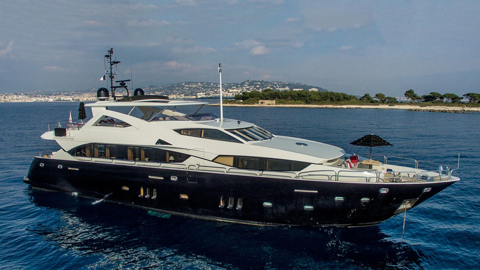 a large boat in the water aboard TENACITY Yacht for Sale