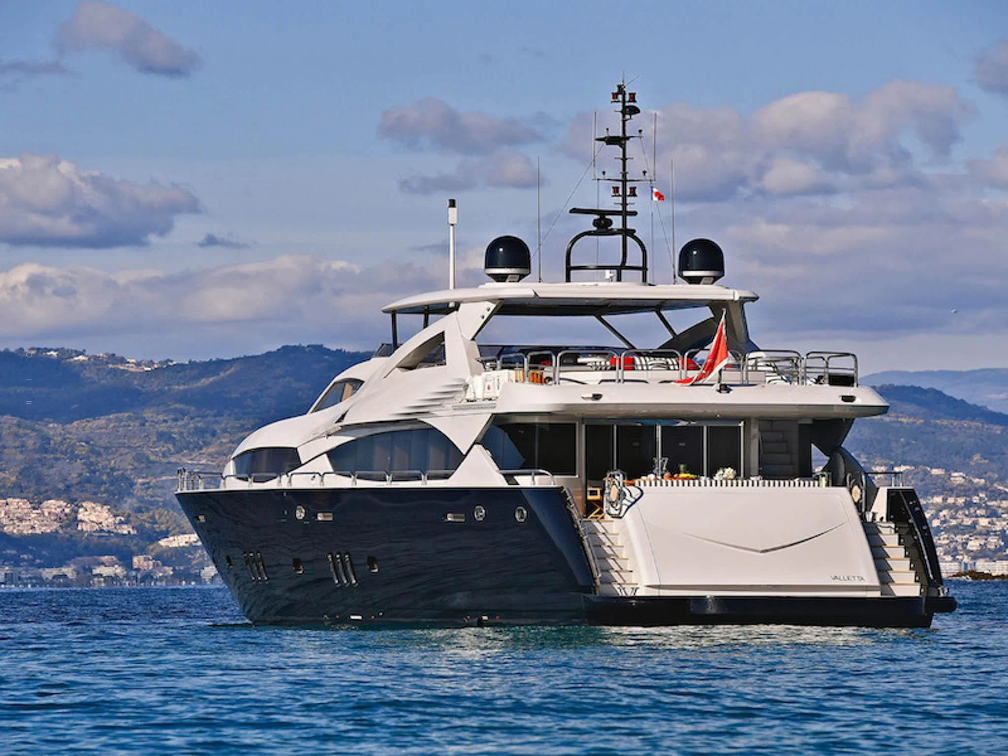 a large boat in the water aboard TENACITY Yacht for Sale