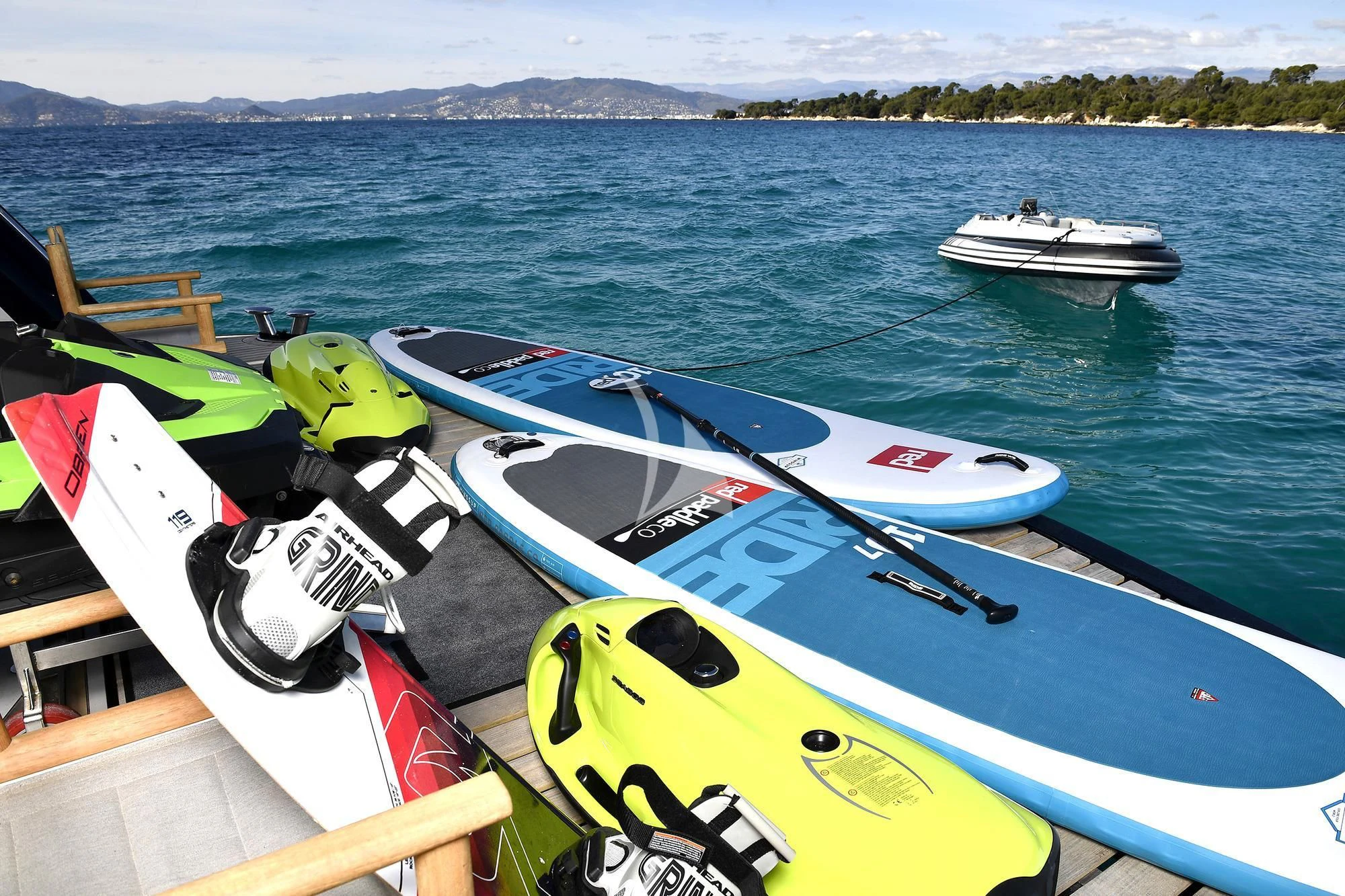a group of boats sit on a dock aboard TENACITY Yacht for Sale