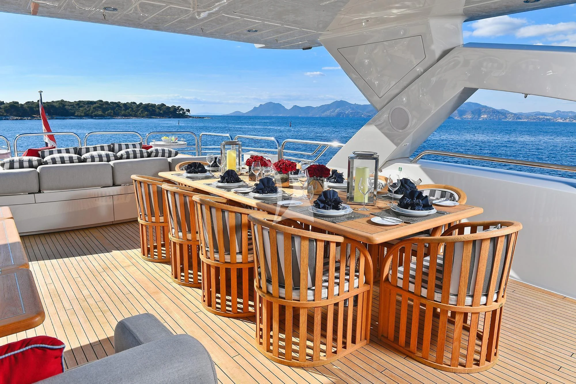 a table with chairs on it aboard TENACITY Yacht for Sale