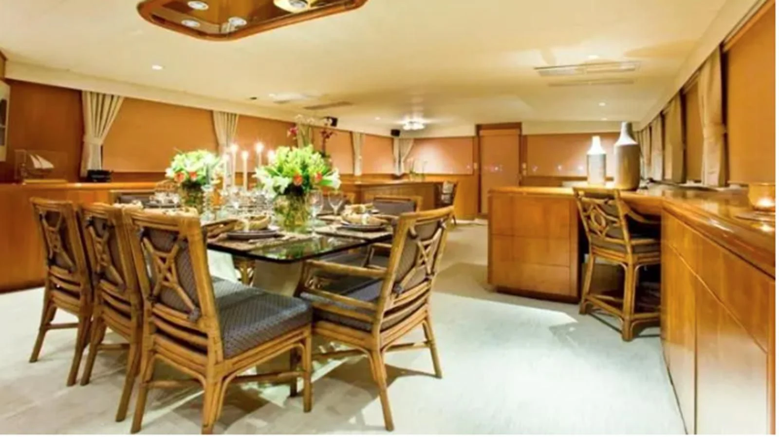 a large kitchen with a dining table aboard GOLDEN EAGLE Yacht for Sale