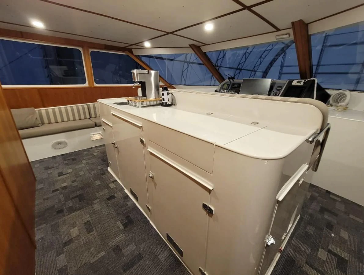 a kitchen with a large white counter aboard GOLDEN EAGLE Yacht for Sale