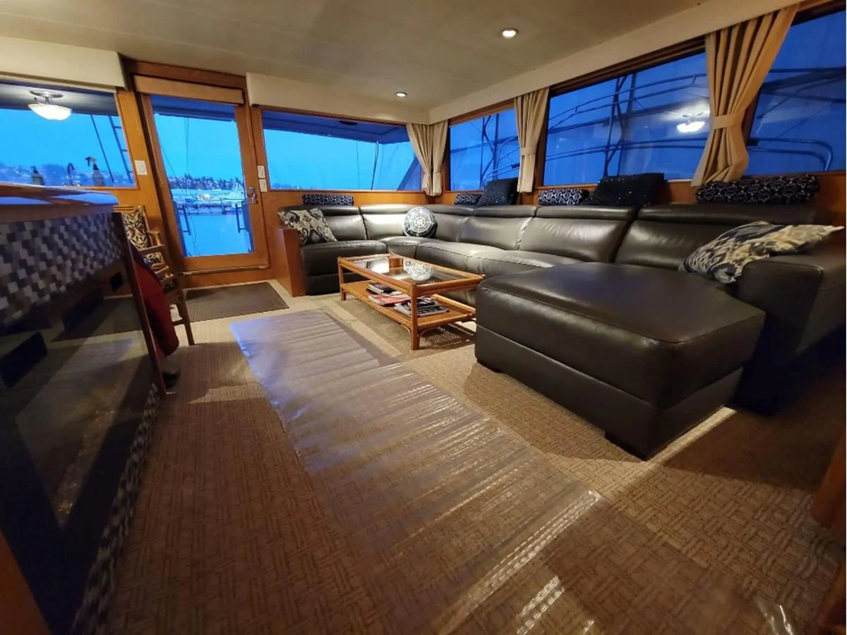 a living room with a large window aboard GOLDEN EAGLE Yacht for Sale