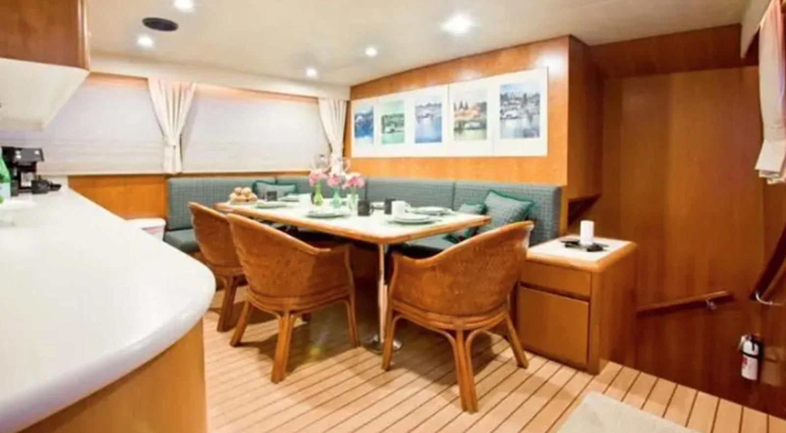 a room with a table and chairs aboard GOLDEN EAGLE Yacht for Sale
