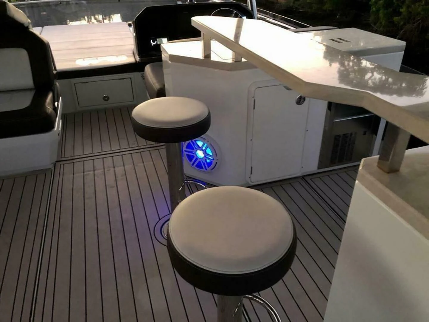 a table with stools and a stool on it aboard GODSPEED Yacht for Sale