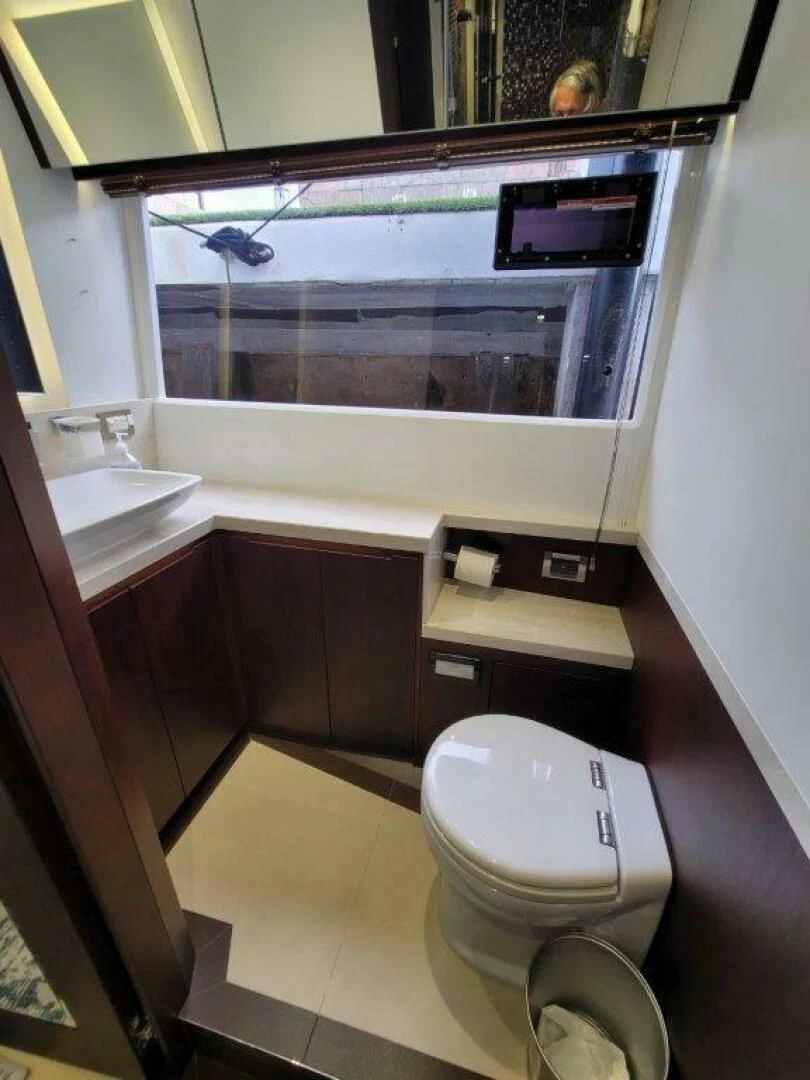 a bathroom with a large mirror aboard GODSPEED Yacht for Sale
