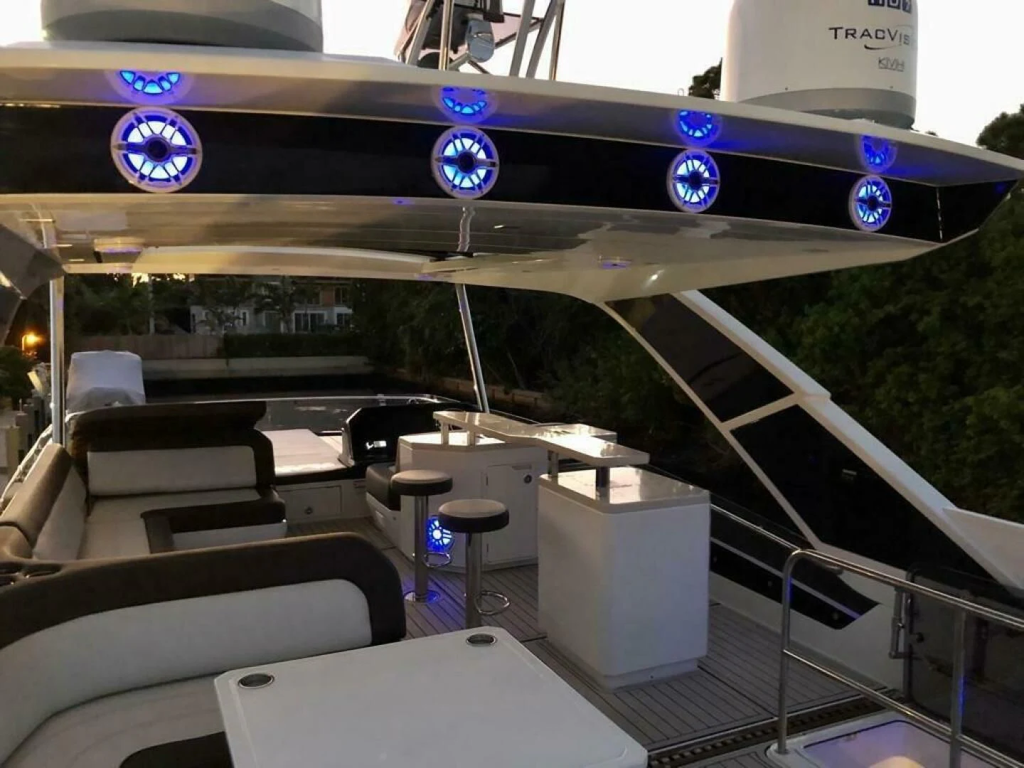 inside of a vehicle with seats and tables and chairs and a sign aboard GODSPEED Yacht for Sale