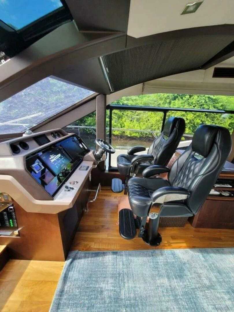 a room with a chair and a tv aboard GODSPEED Yacht for Sale