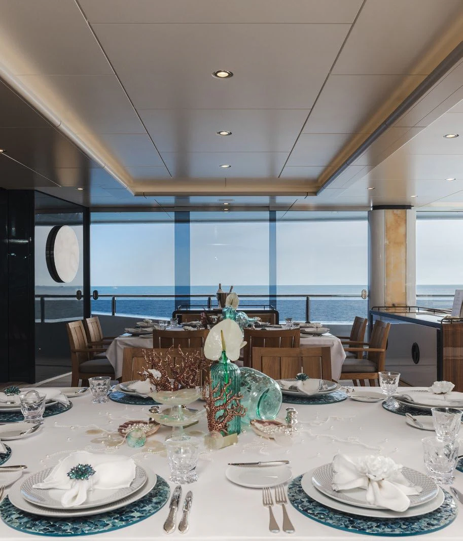 a large dining room with a large window overlooking the ocean aboard ENERGY Yacht for Sale
