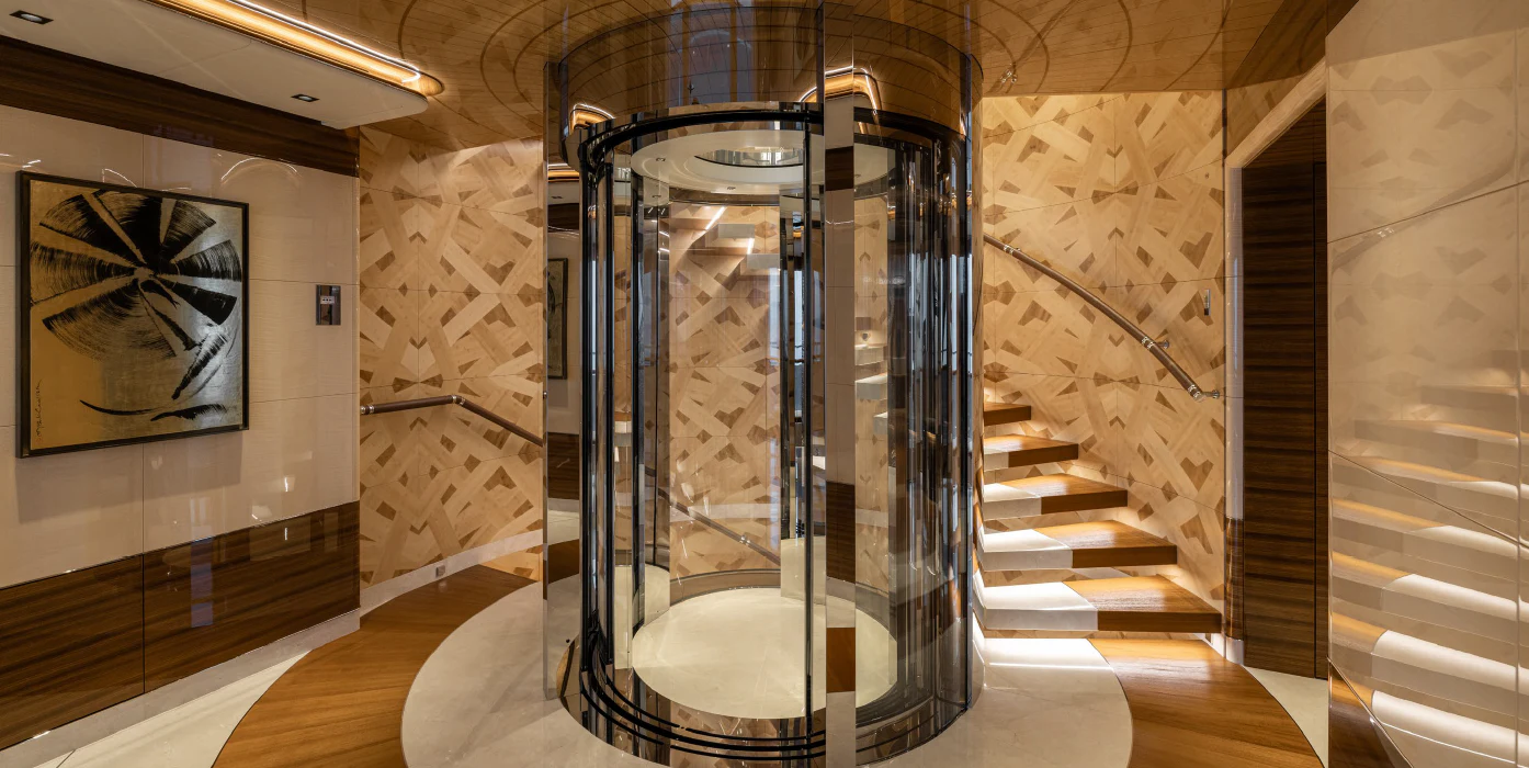 a room with a staircase and glass walls aboard ENERGY Yacht for Sale