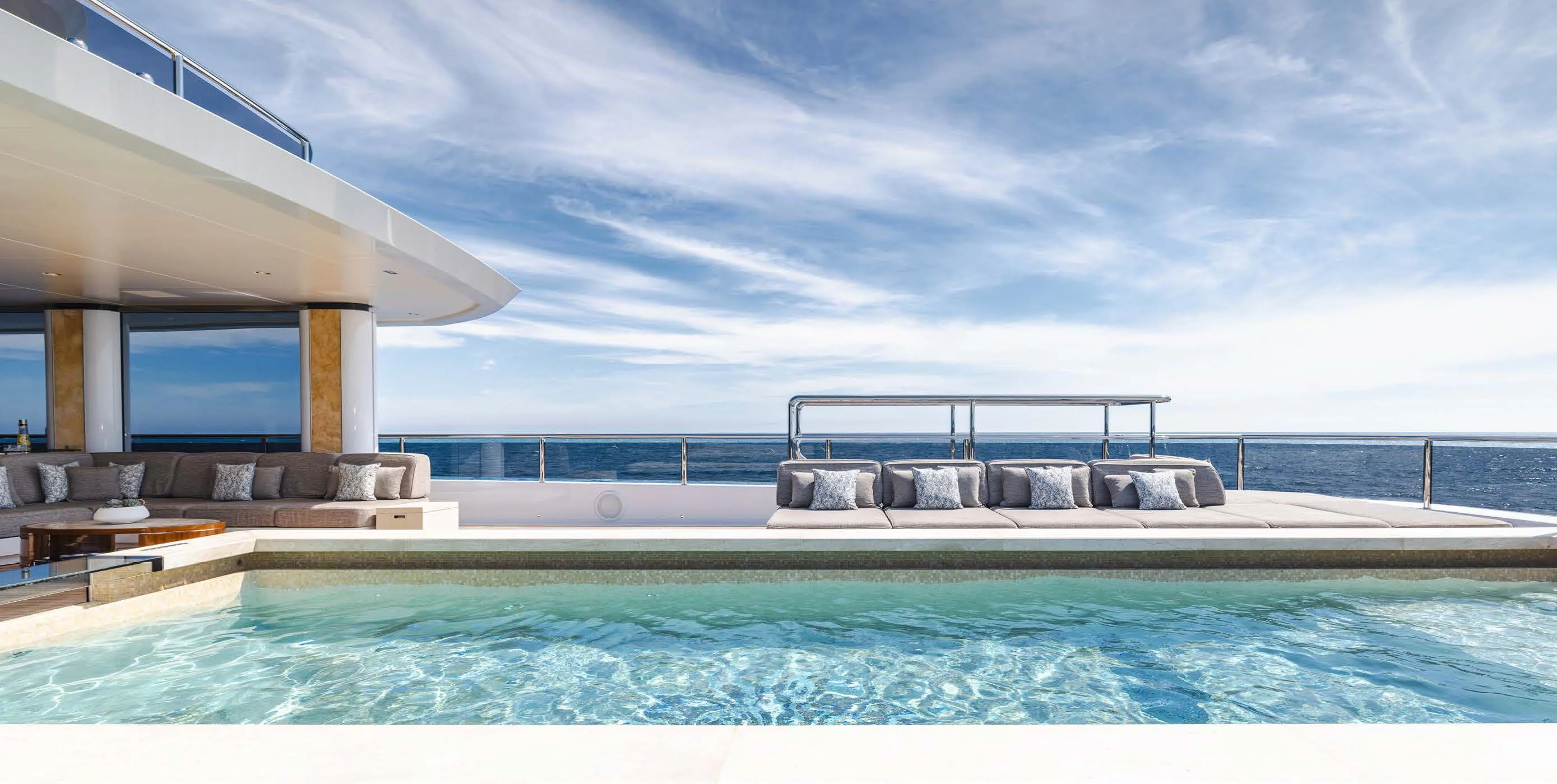 a pool next to a large building aboard ENERGY Yacht for Sale