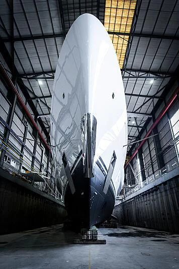a large white surfboard in a warehouse aboard ENERGY Yacht for Sale