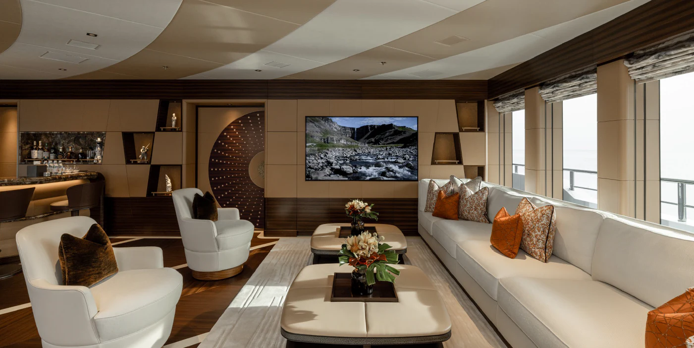 a living room with a large fireplace aboard ENERGY Yacht for Sale